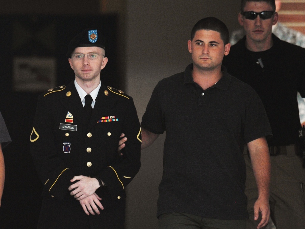 Army Pfc. Bradley Manning is escorted from court on July 25, in Fort Meade, Md.