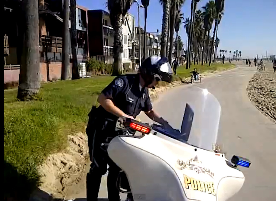 LAPD Video An unidentified LAPD officer is filmed while writing a ticket on the Venice Boardwalk. The image is taken from a video of the incident published on the Internet that has gotten more than 300,000 views.