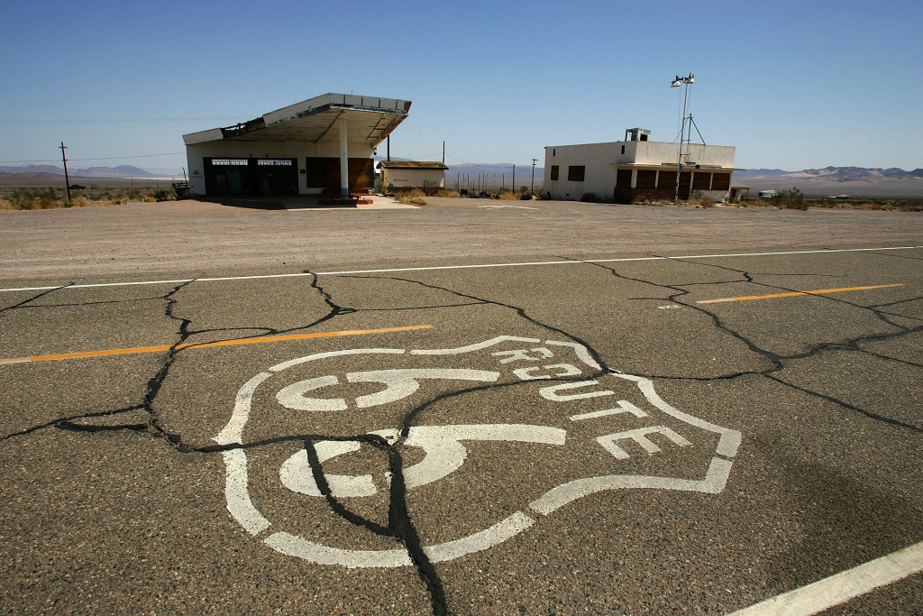 Historical Route 66 Increasingly Threatened By Development A symbol based on the original Route 66 road signs is seen painted on the highway near an abandoned gas station and cafe on June 16, 2007 in Ludlow, California.