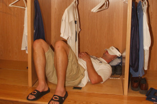 Linebacker Joe Odom #59 of the Chicago Bears takes a nap in his new locker during the media tour the locker room of the rebuilt Soldier Field stadium, home to the NFL Chicago Bears and the MLS Chicago Fire, on September 18, 2003 in Chicago, Illinois.