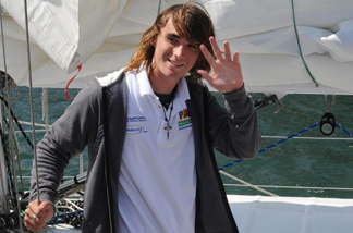 Zac Sunderland of the US waves as he arrives at Marina Del Rey, California, on July, 16, 2009. The 17 year old teenager became the youngest person to circumnavigate the world alone by yatcht.