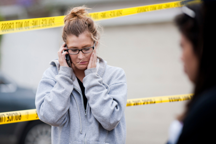A student waits on the periphery of the Santa Monica College campus on Friday afternoon.