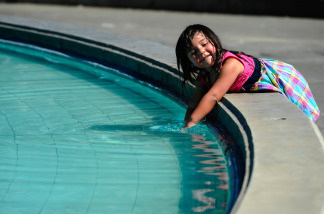 Penelope Rosendo, 3, splashes water in the fountain named after William Mullholand at Griffith Park on September 27, 2010 in Los Angeles, California.