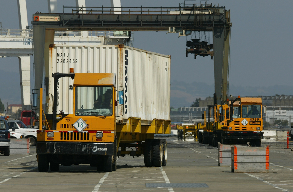Coast Guard Boards Foreign Ships To Check Security A truck drives off with a shipping container at the Port of Oakland July 1, 2004 in Oakland, California.