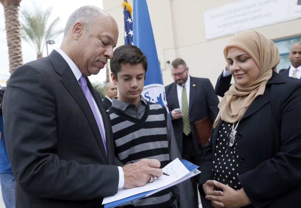 Homeland Security Secretary California Homeland Security Secretary Jeh Johnson, left, gives an autograph to Hamza Salem, 14, as his mother Metra Salem watches following a news conference after the secretary's visit to the Islamic Center of the San Gabriel Valley in Rowland Heights, Calif., Thursday, Nov. 13, 2014. (AP Photo/Nick Ut)
