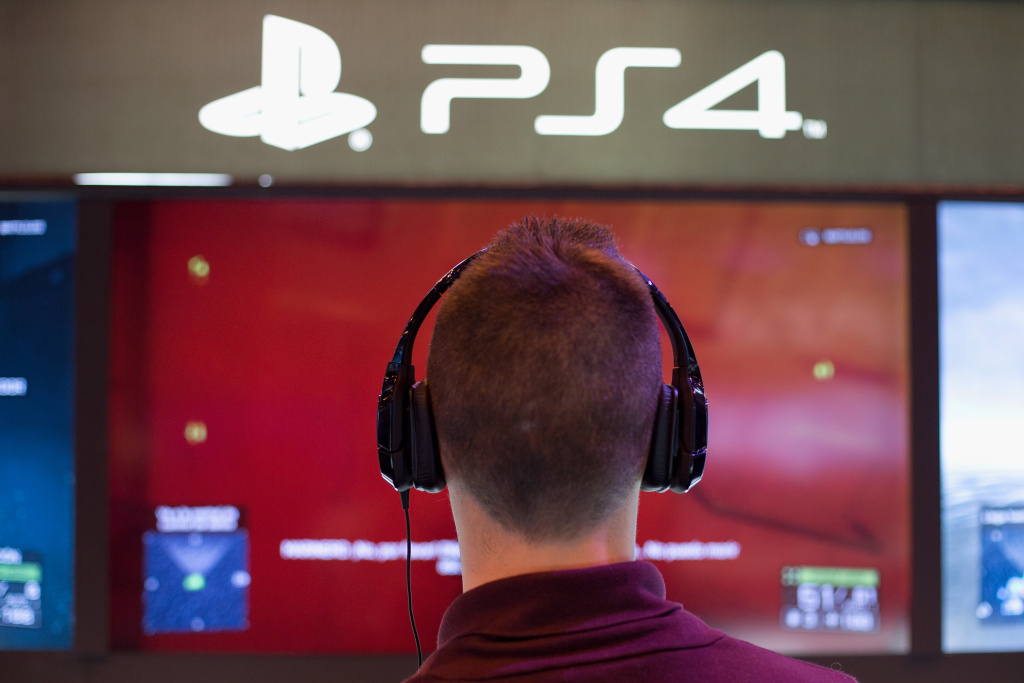 First Edition Of Madrid Games Week A man plays on a Playstation 4 at Madrid Games Week in IFEMA on November 9, 2013 in Madrid, Spain.