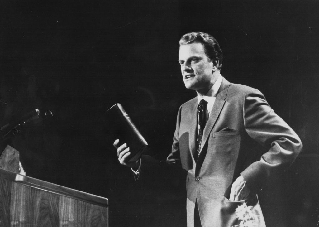 Billy Graham American evangelist Billy Graham, giving a speech on stage, circa 1970.
