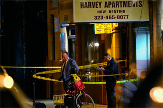 The scene Wednesday, December 1, 2010 outside the Los Angeles apartment house where a man authorities wanted to question about the murder of publicist Ronni Chasen killed himself as police approached.