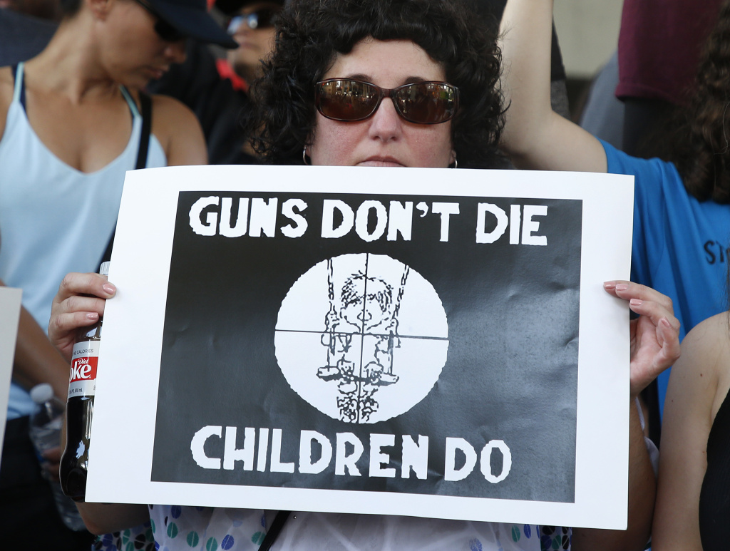 US-SCHOOL-SHOOTING-PROTEST After a school shooting that killed 17, people protest guns on the steps of the Broward County Federal courthouse on February 17, 2018 in Fort Lauderdale, Florida.