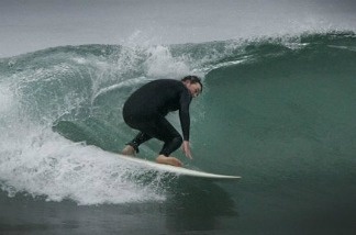 Mercer 21195 Professor Ponting rides a wave