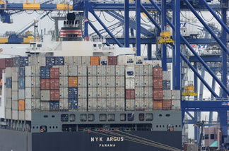File photo: A container ship being unloaded is visible during the launch voyage of the Aquarium of the Pacific's new 'Urban Ocean' cruise, May 27, 2010 in San Pedro Bay off the coast of Los Angeles and Long Beach.