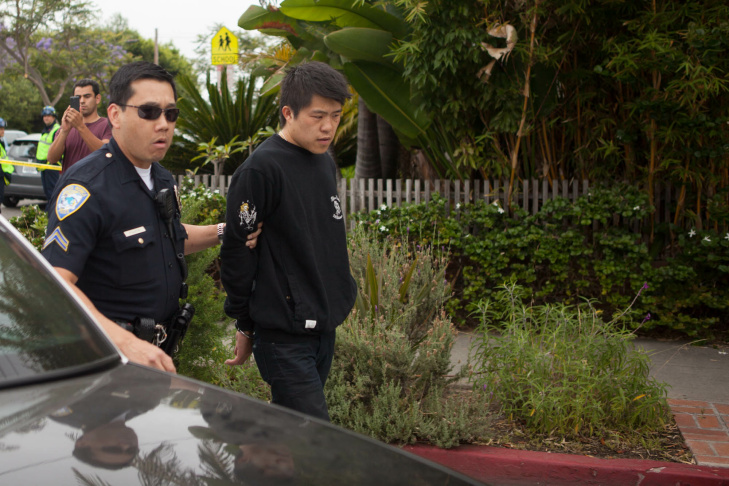 A student waits on the periphery of the Santa Monica College campus on Friday afternoon.