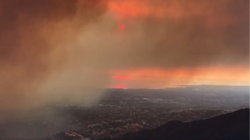 California Wildfires In this image taken from video provided by the Santa Barbara County Fire Department, smoke from a wildfire drifts towards Santa Barbara Airport in the distance in Santa Barbara, Calif., Saturday, Dec. 16, 2017. The Thomas Fire is now the third-largest in California history.