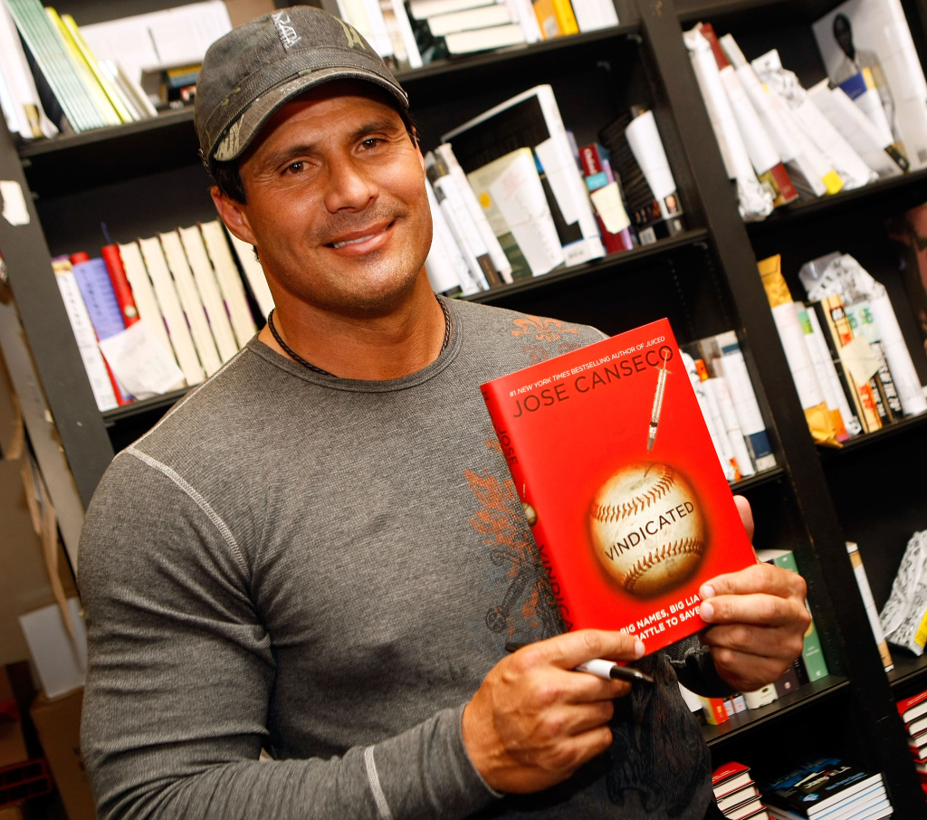 Former baseball player and author Jose signs copies of his new book "Vindicated: Big Names, Big Liars, and the Battle to Save Baseball" at Book Soup on April 7, 2008 in Los Angeles, California.