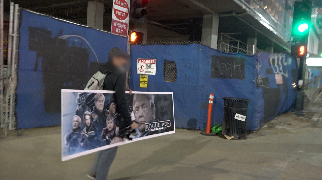 Conservative street artist Sabo preparing to put up a fake bench ad parodying the movie Conservative street artist Sabo preparing to put up a fake bench ad parodying the movie
