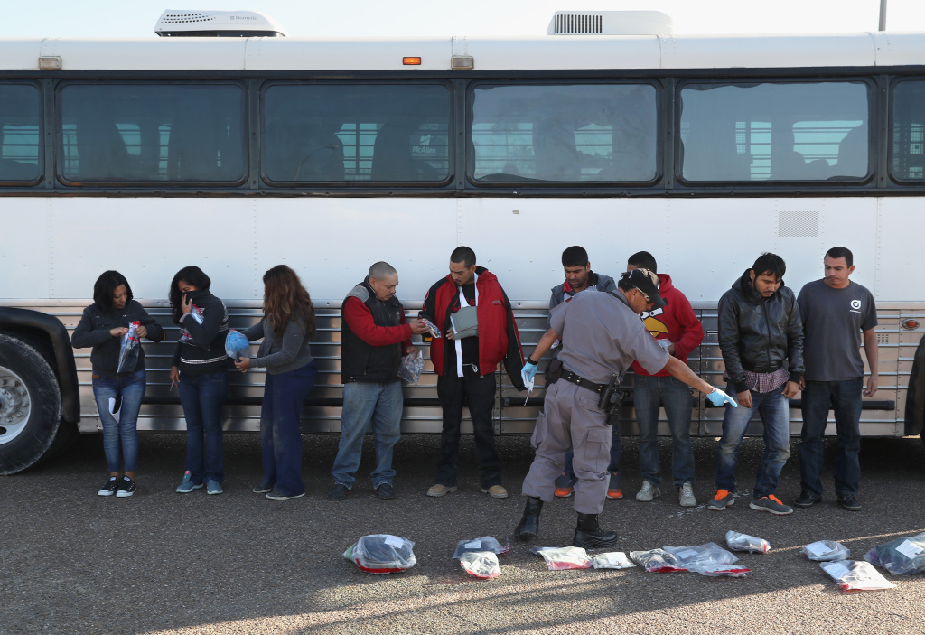 Customs And Border Protection Patrols U.S. Border As Illegal Crossings Plummet Immigrants collect their belongings before being deported across an international bridge into Mexico on March 14, 2017 from Hidalgo, Texas.