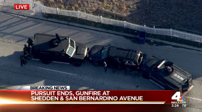 Two military style vehicles block an SUV after a shootout with the couple who carried out the mass shootings in San Bernardino on Dec. 2, 2015. File photo.