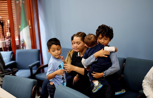 mexischool_022_custom-b8c45141f1a8353ed773bde9fdc097827b6ddc54-s500-c85.jpg A family waits before a class for new student arrivals to Mexico at the Tijuana Education Department in Tijuana, Mexico.