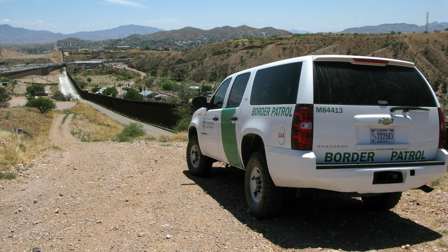 A Border Patrol vehicle patrols the fence separating the cities of Nogales, Ariz., and Nogales, Sonora. The fence has been rebuilt twice. A Border Patrol vehicle patrols the fence separating the cities of Nogales, Ariz., and Nogales, Sonora. The fence has been rebuilt twice.