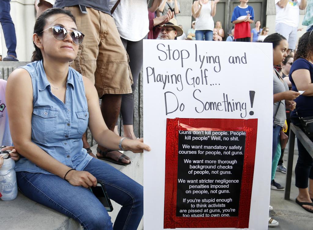 US-SCHOOL-SHOOTING-PROTEST After a school shooting that killed 17, people protest guns on the steps of the Broward County Federal courthouse on February 17, 2018 in Fort Lauderdale, Florida.