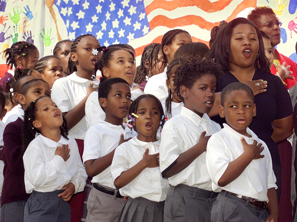 Students from Amido Elementary School give the Ple Students from Amido Elementary School give the Pledge of Allegiance 12 October 2001 in Washington, DC.