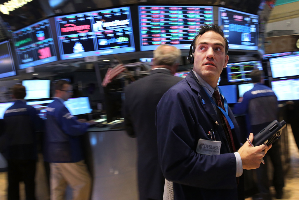 Markets Slide Downward As Government Shutdown Enters Second Week Traders work on the floor of the New York Stock Exchange minutes before the closing bell on October 8, 2013 in New York City. As concerns grow throughout the country and world over the continued U.S. Government shutdown, the Dow Jones Industrial Average and the S&P 500 were both down by close to 1%. The Nasdaq lost close to 2%.
