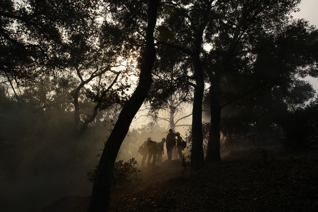 California Wildfires Firefighters from Kern County, Calif., work to put out hot spots during a wildfire Saturday, Dec. 16, 2017, in Montecito, Calif.