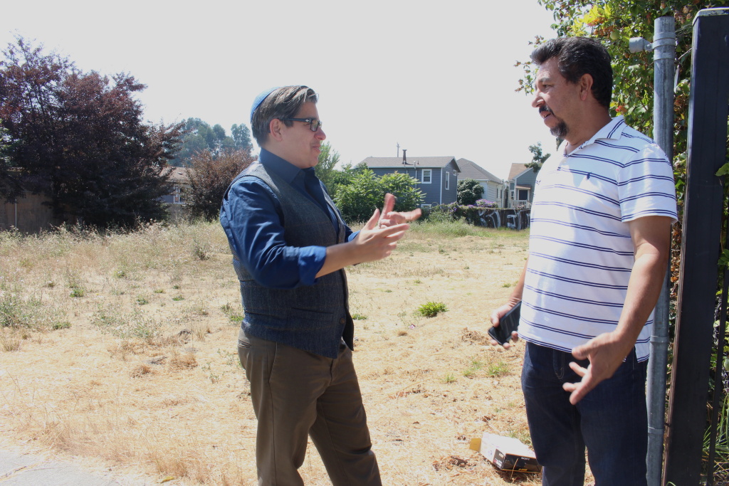 Councilmember Rebecca Kaplan speaks with property owner Francisco Acosta in front of a vacant lot in West Oakland on Aug. 20, 2018. Kaplan authored a proposed tax on vacant properties to help ease homelessness in the city.
Councilmember Rebecca Kaplan speaks with property owner Francisco Acosta in front of a vacant lot in West Oakland on Aug. 20, 2018. Kaplan authored a proposed tax on vacant properties to help ease homelessness in the city.
