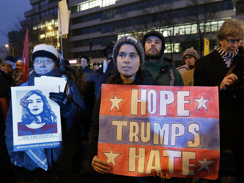 Protesters attend an anti-Trump demonstration in front of the headquarters of the Alternative for Germany, a far-right party in Berlin, on Friday. Protesters attend an anti-Trump demonstration in front of the headquarters of the Alternative for Germany, a far-right party in Berlin, on Friday.