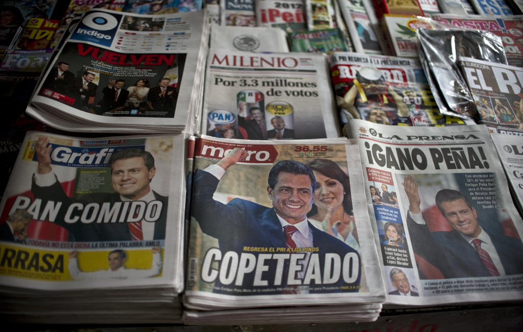 Front pages of newspapers with informati Front pages of newspapers with information on the new Mexican president for the Institutional Revolutionary Party (PRI), Enrique Pena Nieto, on July 2, 2012. Pena Nieto, the youthful candidate of the party that governed Mexico for decades, claimed victory late on July 1 in the country's presidential election.