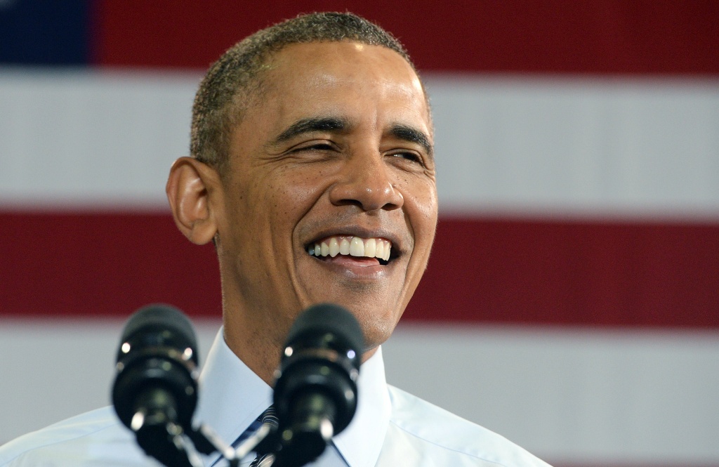 US-POLITICS-OBAMA US President Barack Obama smiles as he speaks at the Costco in Lanham, Maryland, on January 29, 2014.