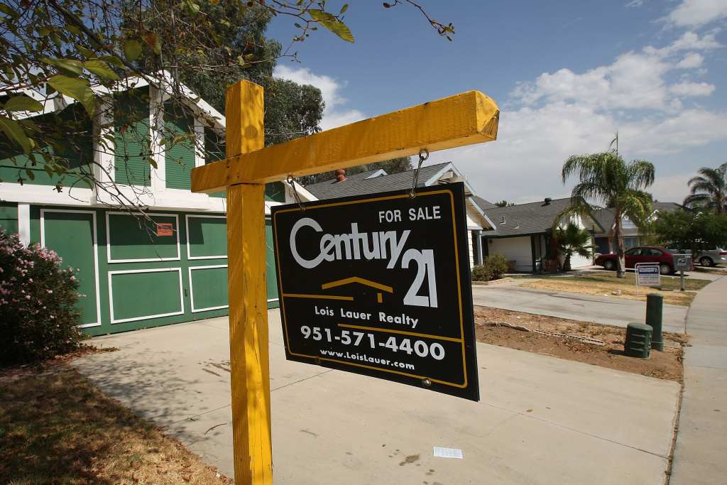 While Sales Of Existing Homes Rise In July, Prices Continue To Fall Two vacant homes are for sale on August 25, 2008 in Moreno Valley, California.