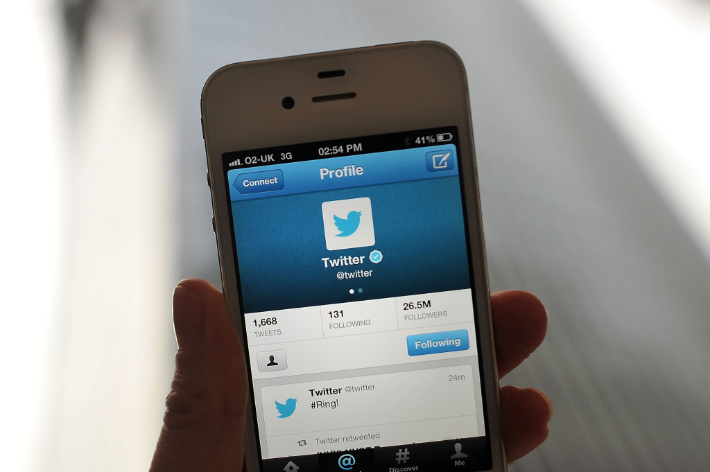 Social Media Site Twitter Debuts On The New York Stock Exchange LONDON, ENGLAND - NOVEMBER 07: In this photo illustration, the Twitter logo and hashtag '#Ring!' is displayed on a mobile device as the company announced its initial public offering and debut on the New York Stock Exchange on November 7, 2013 in London, England. Twitter went public on the NYSE opening at USD 26 per share, valuing the company's worth at an estimated USD 18 billion. (Photo by Bethany Clarke/Getty Images)
