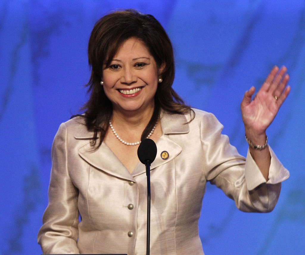 Congress Harassment FILE - In this Aug. 27, 2008 file photo, then-Rep. Hilda Solis, D-Calif., waves as she speaks at the Democratic National Convention in Denver. One current and three former female members of Congress tell The Associated Press they have been sexually harassed or subjected to hostile sexual comments by their male colleagues while serving in the House. Solis, now a Los Angeles County supervisor, recalls repeated unwanted harassing overtures from one lawmaker, though she declined to name him or go into detail. (AP Photo/Ron Edmonds, File)