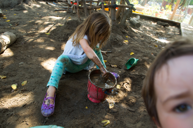 A preschool student at La Canada's Child Educational Center plays with mud. Jordan Young, a neuroscientist,  emphasizes that associations between gender and color, or gender and specific activities aren’t hardwired in the baby’s brain – the physical and social environment we give to kids builds them up