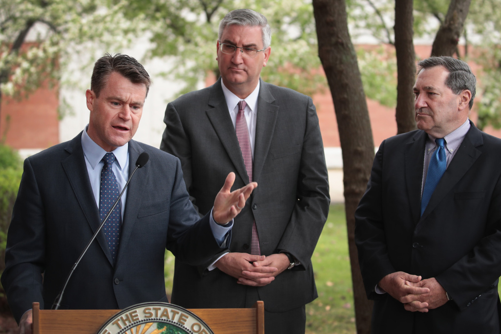 EPA Administrator Scott Pruitt And Local Officials Tour East Chicago Superfund Site U.S. Senator Todd Young (R-IN) (L), Indiana Gov. Eric Holcomb (C) and U.S. Senator Joe Donnelly (D-IN) address the media after meeting with former residents and taking a brief tour of the West Calumet Housing Complex with EPA Administrator Scott Pruitt on April 19, 2017 in East Chicago, Indiana.