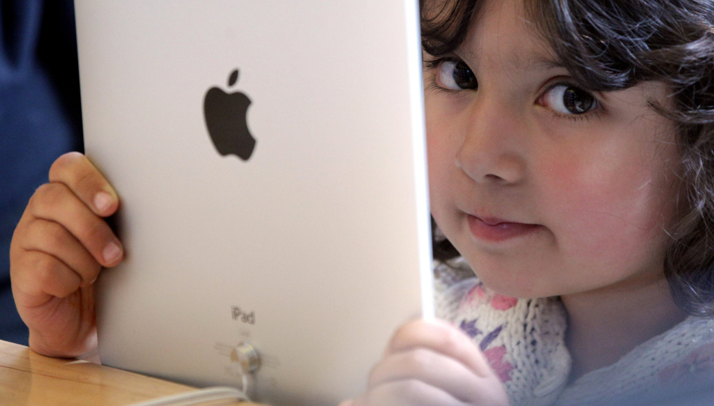 A young girl holds an Apple iPad on display at Regent Street's Apple store on May 28, 2010 in London, England.