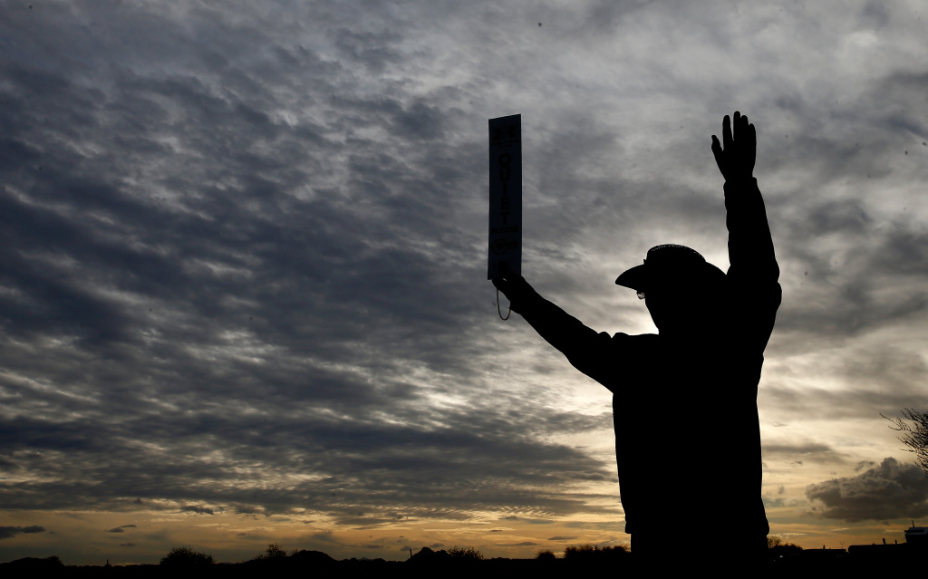 Waste Management Phoenix Open - Round Two A marshal displays a quiet sign during the second round of the Waste Management Phoenix Open at TPC Scottsdale on January 31, 2014 in Scottsdale, Arizona.