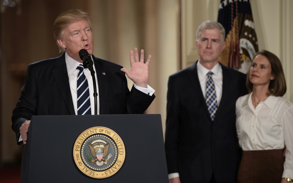 US-POLITICS-COURT-NOMINATION Judge Neil Gorsuch (C) and his wife Marie Louise look on, after President Donald Trump nominated him for the Supreme Court, at the White House in Washington, D.C., on Jan. 31, 2017.
President Donald Trump nominated federal appellate judge Neil Gorsuch as his Supreme Court nominee, tilting the balance of the court back in the conservatives' favor.