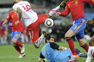 Switzerland's striker Eren Derdiyok (L, up) jumps over Spain's goalkeeper Iker Casillas (down) during their Group H first round 2010 World Cup football match on June 16, 2010 at Moses Mabhida stadium in Durban.