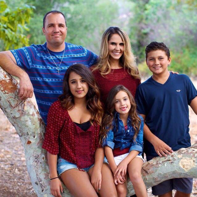 Jail suicides Heron Moriarty (left) with his wife of 18 years, Michelle, and their three children.