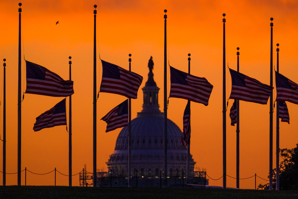Nightclub Shooting Florida Reaction Flags fly at half-staff around the Washington Monument at daybreak in Washington with the US Capitol in the background Monday, June 13, 2016. President Barack Obama ordered flags lowered to half-staff to honor the victims of the Orlando nightclub shootings.