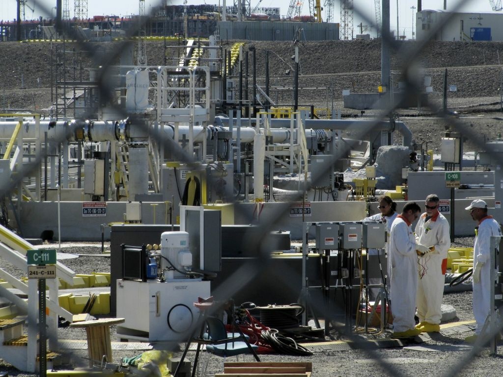 Workers at the Hanford Nuclear Reservation near Richland, Wash., in 2010. Workers at the Hanford Nuclear Reservation near Richland, Wash., in 2010. Washington's governor prepared Wednesday to travel to the nation's most contaminated nuclear site to learn more about leaking radioactive waste tanks, a day after federal officials acknowledged budget cuts may disrupt efforts to empty the aging vessels. South-central Washington's Hanford Nuclear Reservation is home to 177 underground tanks, which hold toxic and radioactive waste left from decades of plutonium production for the country's nuclear weapons arse