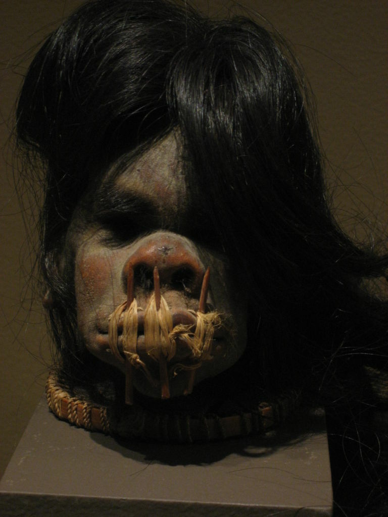 The newest Bowers Museum exhibit includes two shrunken heads, including this one from Ecuador in the early 20th century. The warrior created the head from a rival killed in battle. The warrior sewed the mouth shut to keep in - and carry around - the rival's power.