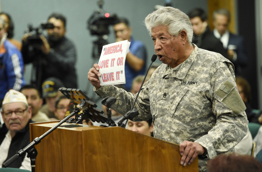 Anti Military Teacher U.S. Army veteran Raul Rodriguez Jr. of Apple Valley, Calif., addresses Pico Rivera City Councilman and El Rancho High School teacher Gregory Salcido during a city council meeting at Pico Rivera City Hall on Tuesday, Feb. 13, 2018, in Pico Rivera, Calif. The city council was to consider a resolution asking for the resignation of Salcido, who was recorded making anti-military remarks to his students in January.