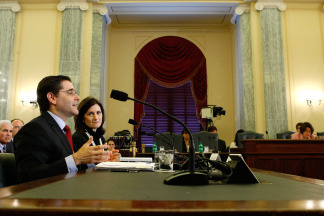 Federal Communications Commission Chairman Julius Genachowski, left, speaks as Assistant U.S. Attorney General for Antitrust Christine Varney, right, listens during a hearing before the Senate Commerce, Science and Transportation Committee March 11, 2010 on Capitol Hill in Washington, DC. The hearing was to examine the proposed Comcast-NBC merger.