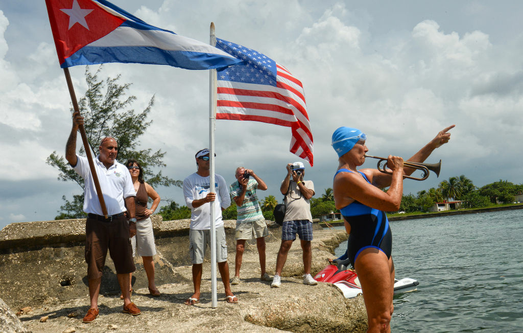 US swimmer Diana Nyad (C) plays a bugle before her departure from the Ernest Hemingway Nautical Club in Havana on August 18, 2012.