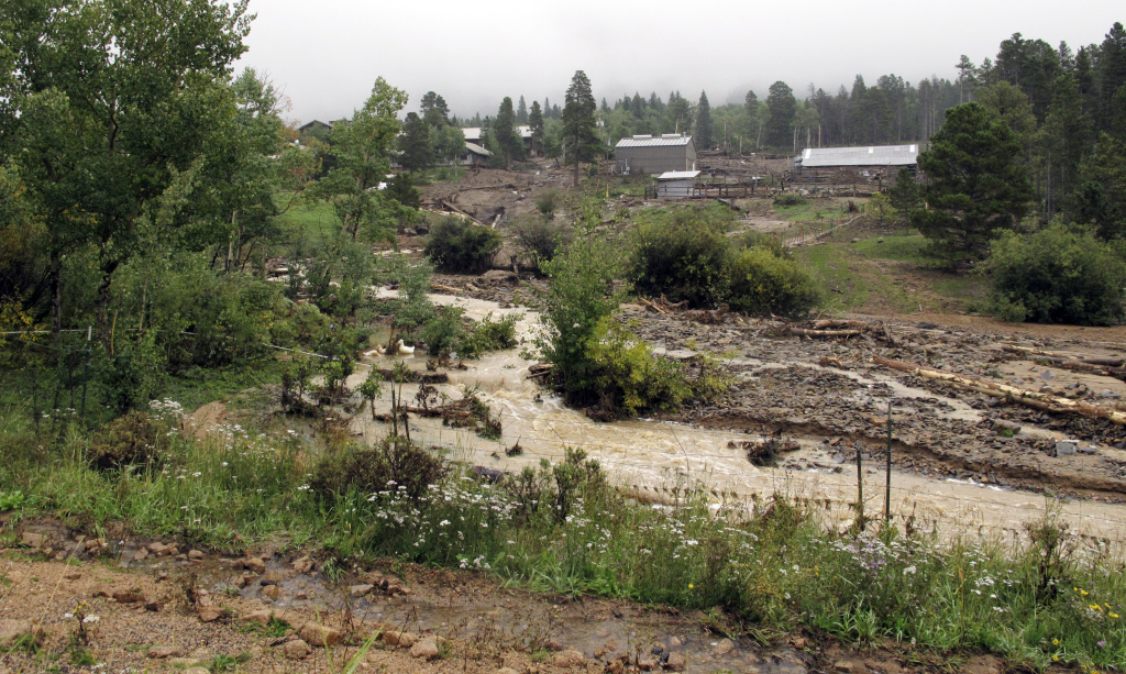 Colorado Flooding A mudslide along the side of the highway leading into the mountain town of Estes Park, Colo., is shown Sunday, Sept. 15, 2013. Estes Park town administrator Frank Lancaster said visitors who would normally flock there during the golden September days should stay away for at least a month, but it could take a year or longer for many of the mountain roadways to be repaired.