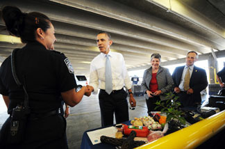 President Barack Obama (2nd L) and Homeland Security Secretary Janet Napolitano (3rd L) visit a border post between the US and Mexico on May 10, 2011 in El Paso, Texas.