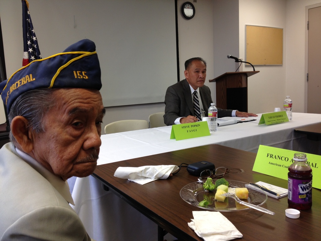 Franco Arcebal, a former Filipino guerrilla intelligence officer in WWII, at a meeting in Los Angeles with a Department of Veterans' Affairs representative. In Southern California, Filipino Americans are among the Asian American groups with the most economic success, according to a new report; other groups haven't fared as well. 